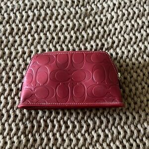 Small red coach makeup bag
